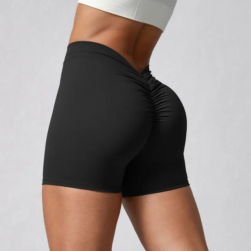 Pantalones cortos de yoga con cintura en V y fruncido trasero Tela