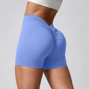 Pantalones cortos de yoga con cintura en V y fruncido trasero Tela