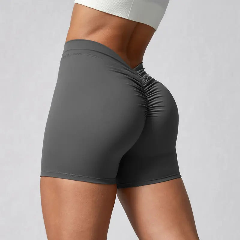 Pantalones cortos de yoga con cintura en V y fruncido trasero Tela
